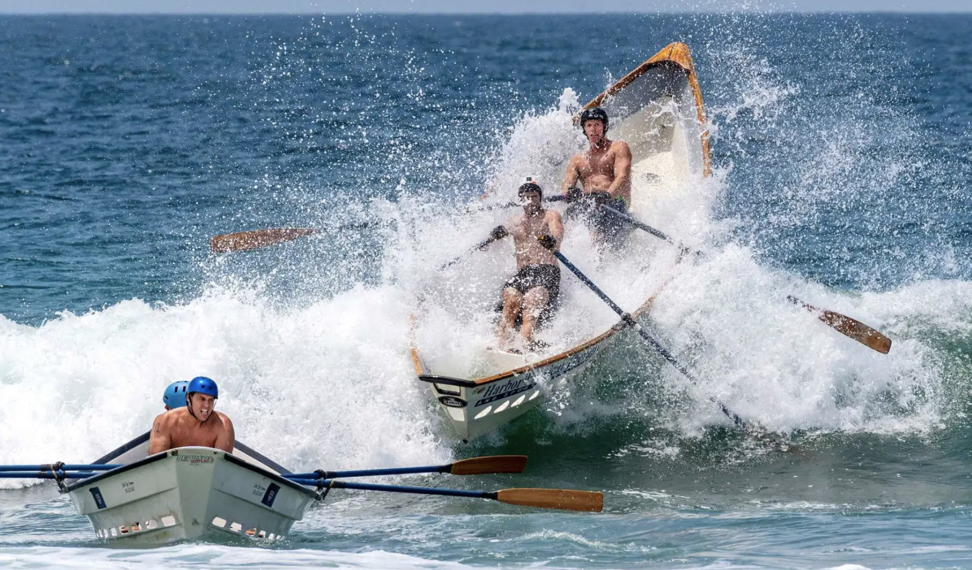 Competitors in the surfboat race crash through shore break waves during the California Surf Lifesaving Championships at Huntington State Beach in Huntington Beach on Saturday, July 24, 2021. (Photo by Mark Rightmire, Orange County Register/SCNG)